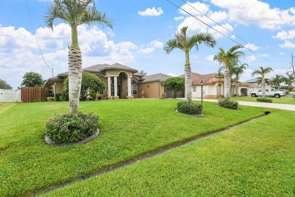 Photo of 390 SW Jeanne Avenue, Port Saint Lucie, FL 34953 (MLS # B26069767)