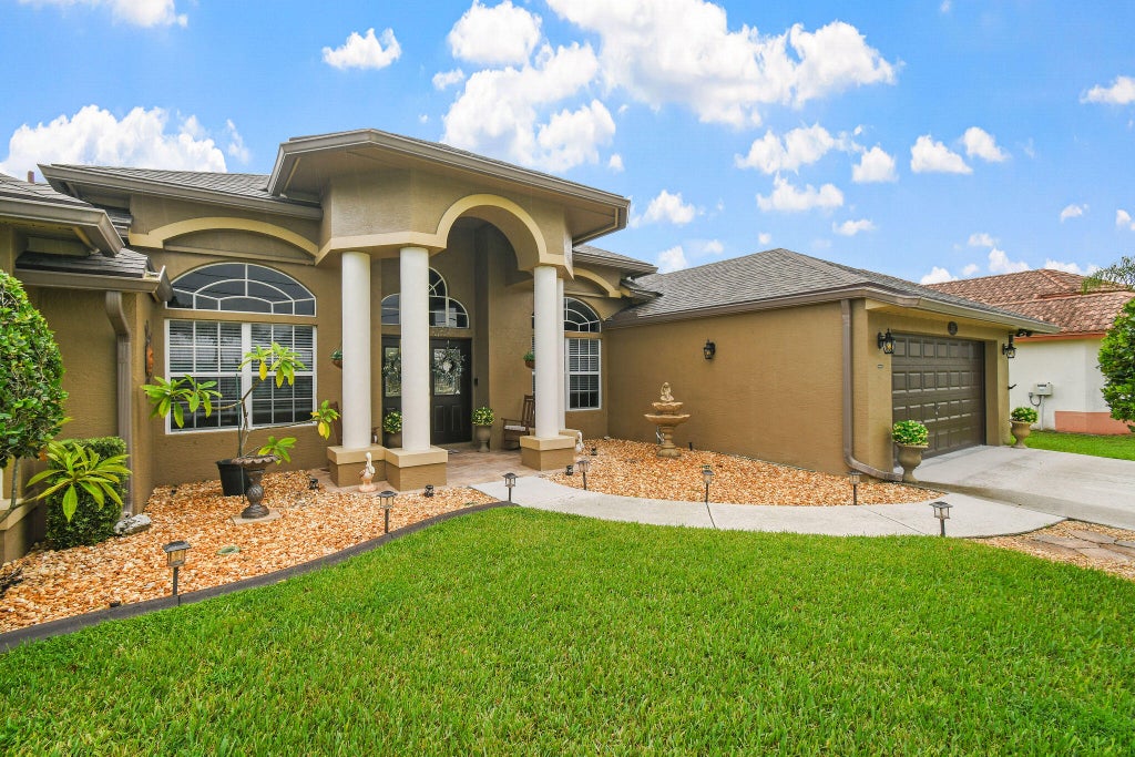 Photo of 390 SW Jeanne Avenue, Port Saint Lucie, FL 34953 (MLS # B26069767)