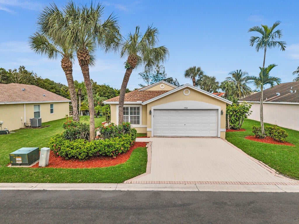 Photo of 1788 SAWGRASS Circle, Greenacres, FL 33413 (MLS # B26089997)
