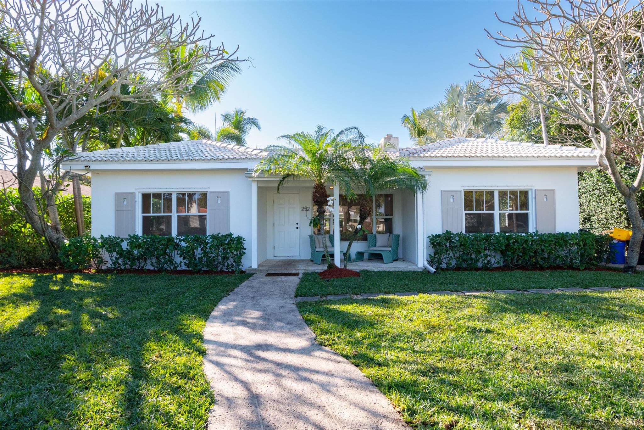 Charming single-family home, beautifully remodeled and upgraded. The property includes a 3-bedroom, 2-bath main residence, along with a fully equipped 1-bedroom, 1-bathroom guest cottage. The main house offers an excellent layout, featuring a spacious living room with a cozy fireplace and a bright, airy kitchen with ample space. Set on a large, professionally landscaped lot, the home is located south of Southern Blvd and east of Olive Ave, within the highly sought-after South Olive Elementary School district.