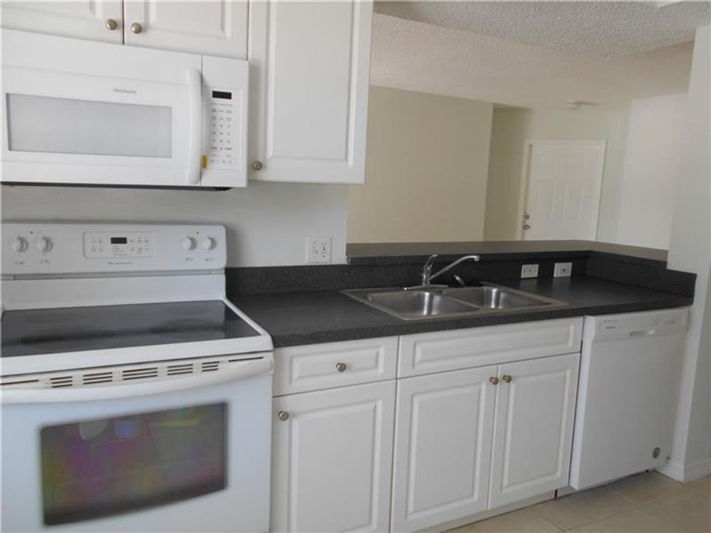 Photo of 9620 NW 2nd Street #7-201, Pembroke Pines, FL 33024 (MLS # B26048754)
