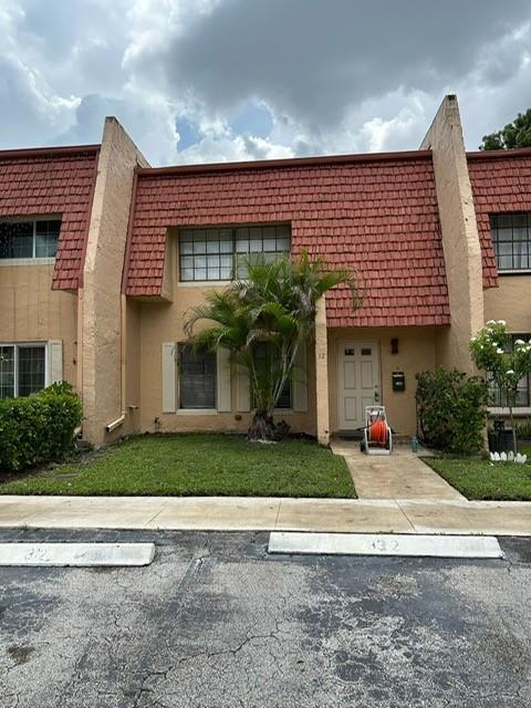 Located just a few minutes West of the Turnpike entrance on Commercial Blvd. Convenient parking (2 spots) at your front door plus guest parking. Both bedrooms upstairs are en suite (each with a private bathroom). 1/2 bath downstairs for guests. Roofed, screened patio overlooks yard and canal. Close to shopping, dining. Community pool. New microwave, new dishwasher, new washer & dryer, stainless steel refrigerator. Tile and laminate floors on 1st level, carpeted stairs and 2nd level.