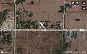 Partially Cleared; Fenced lot, almost 3 acres. Zoned AG 2.5 ''no restrictive covenants''. Great location west Midway road close to the fairgrounds and close to 95.Build your dream with quest house, Day Care, Kennels, Ag services or Ag production, Air Hanger etc.
