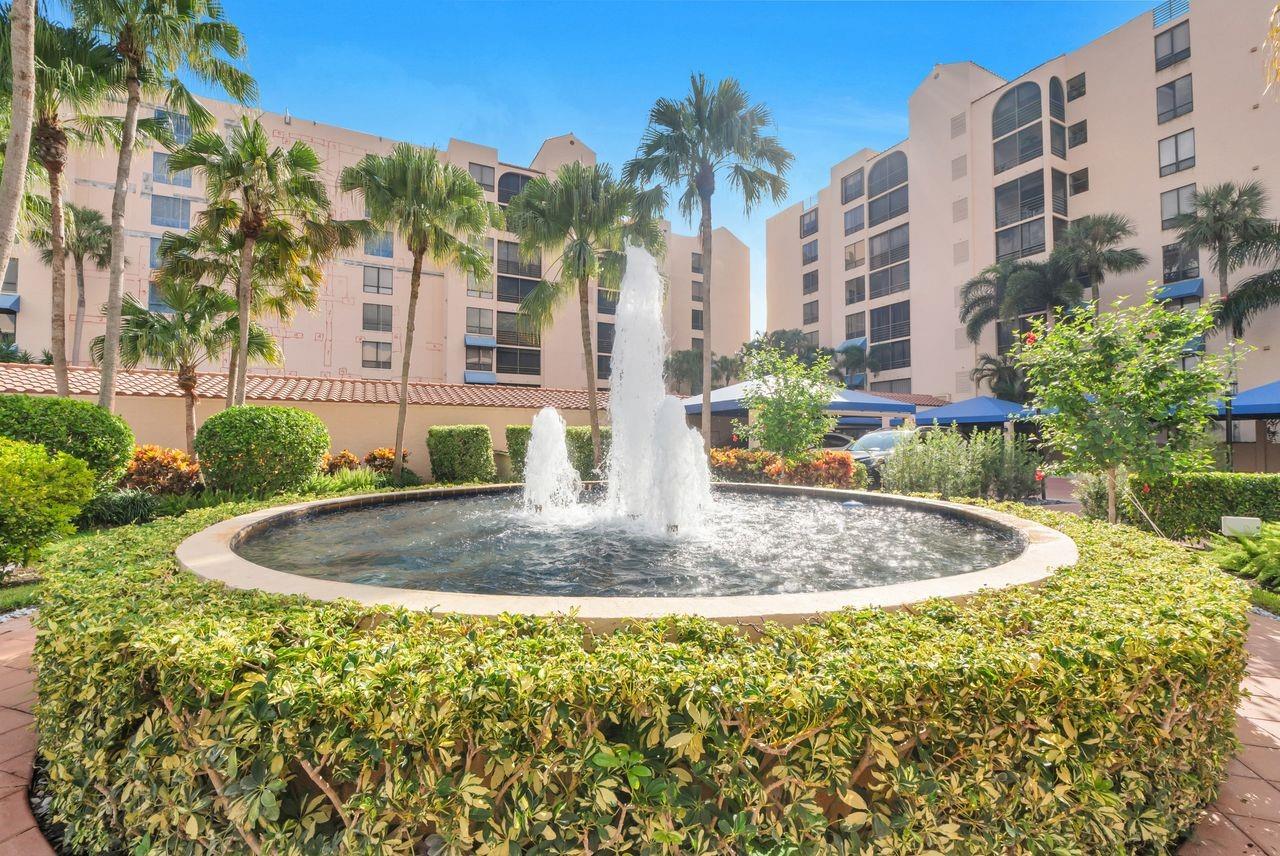 Located in prestigious Promenade at Boca Pointe. Remodeled kitchen, baths and flooring make this home easy to move into. Oversized Master suite has enormous closet, dressing area with additional storage space, and master bath with large separate tub and shower. A triple window allows for beautiful view of pond, golf course and swaying palm trees. The guest suite has its own private bath and an additional powder room is located conveniently in the hallway. The kitchen is redone with upgraded appliances, lovely counters and a pantry plus an entertaining station including extra storage. Owner has a charming music room which can be a den, office or "whatever" room. Many amenities including community pool, clubhouse jogging trails make this a great place to live and play.