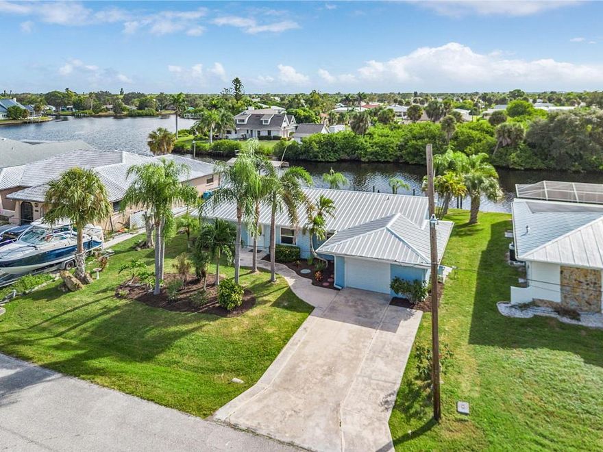 New Price! Gulf Access with Boat Lift! Beautifully updated 3BR/2BA waterfront home in Port Charlotte with 1-car garage and no HOA! Both bathrooms have been completely remodeled, and the kitchen features new cabinets, countertops, and brand-new appliances. Bright, open floor plan with a spacious Florida room offering fantastic water views-perfect for relaxing or entertaining.  Enjoy a large Trex dock with 10,000lb boat lift and access to Charlotte Harbor (15-min by boat) and then on to the Gulf of Mexico. New metal roof installed in 2022. Conveniently located near downtown Punta Gorda, Sunseeker Resort, shops, dining, golfing, and parks. Port Charlotte Beach is 10/12 minutes away; Englewood Beach is 25 minutes. This tastefully renovated home is move-in ready. Buyer is not obligated to use Seller's preferred lender however, Seller's preferred lender will provide a credit of up to $2000 towards closing costs.