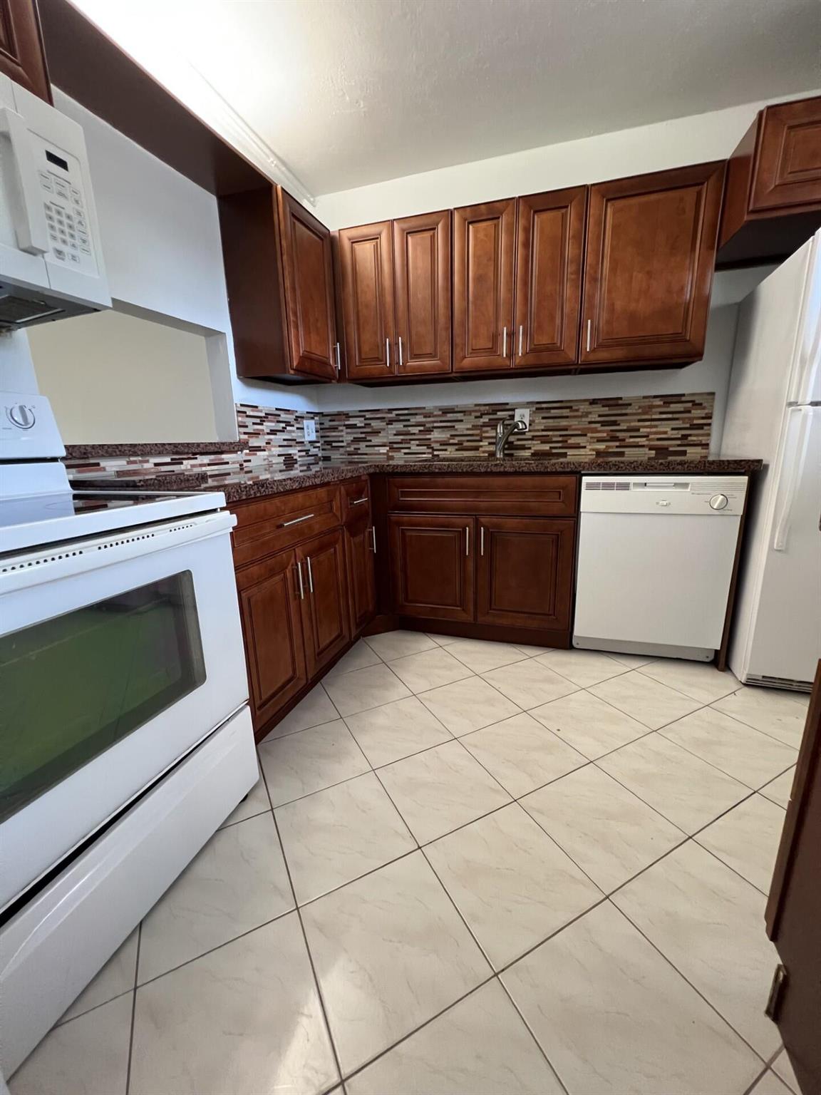 Water is included in a rent. New a/c and water heather. Well maintained 2/2, freshly painted. Features include eat-in kitchen, open living/dining area and large enclosed porch overlooking private green space. The unit also has a storage locker. All ages welcome. Two pets under 30 lbs welcome. Clubhouse includes an exercise room, tennis courts and community pool. Each floor provides a community laundry. Trendy downtown Delray is just a few miles east, with lots of great restaurants, shops, public golf courses and the beach. Lago Del Rey is centrally located; equidistant to I-95, FAU.