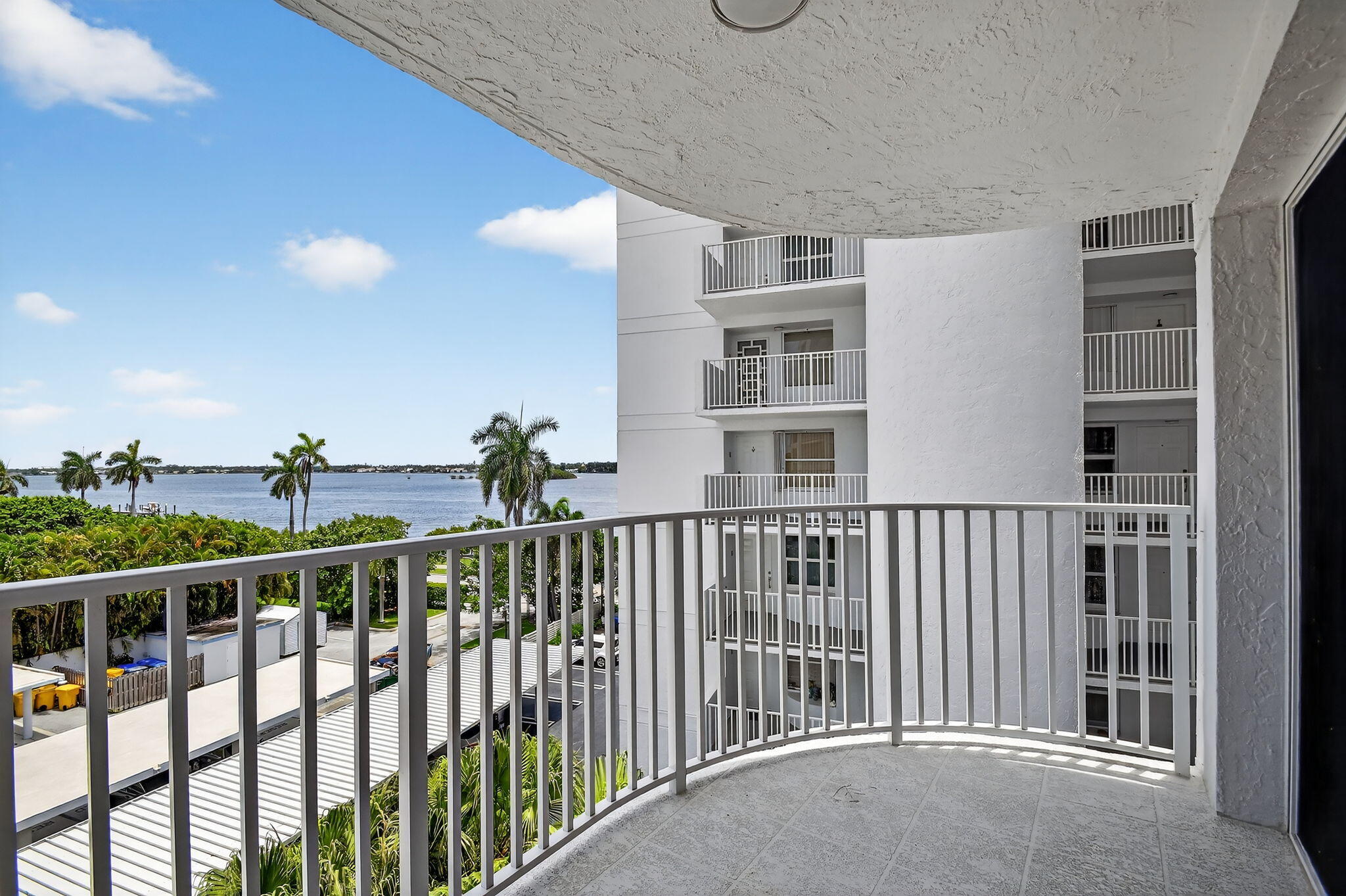 FIRST AND SECURITY MOVES YOU IN!!!PERFECTLY located 5TH FLOOR CONDO with PERFECT INTRACOASTAL VIEWS! No CARPET Anywhere! SPACIOUS 2/2 with a GRACIOUS, OPEN floor plan. Newer Kitchen, Bathroom and Wood Look tiles throughout, Washer / Dryer in unit for your convenience.Schedule your private showing today, this ONE will NOT LAST.