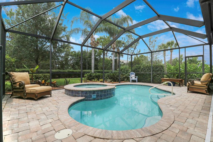 Heated pool and spa home with your own private resort! This stunning 3-bedroom, 3-bath home includes a den and spacious bonus loft, perfect for a home office, guest space, or playroom. The modern kitchen features quartz countertops, stainless steel appliances, and a large island for gathering. Enjoy a bright, open floor plan with plenty of natural light, ideal for entertaining. New impact windows upstairs add storm protection and energy efficiency. Located in a gated community with resort-style amenities: heated pool, spa, fire pit, clubhouse, and fitness center. Near top dining, shopping, I-95, and FL Turnpike