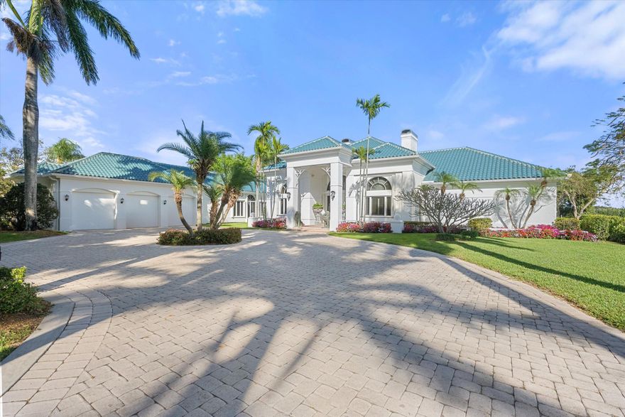 An extraordinary estate on 2.05 acres in the highly desirable Southfields neighborhood. This refined residence boasts approximately 5,964 sf of well-appointed living space with 6 bedrooms, 8 baths, and exceptional water views that create a serene and private setting for everyday living or grand entertaining.

The flowing floor plan includes grand living areas, formal dining, a custom bar, a library, and soaring vaulted ceilings captured by abundant natural light. With an oversized pool and spa integrated seamlessly into the outdoor experience, the property offers an ideal balance of indoor and outdoor living.
Set on a 2.05-acre lakefront site with fenced perimeter, sprinkler system, and horse-friendly zoning, this estate invites both luxury lifestyle and equestrian pursuits. Sale includes only the residence and 2.05-acre lot; the adjacent parcel is NOT included.