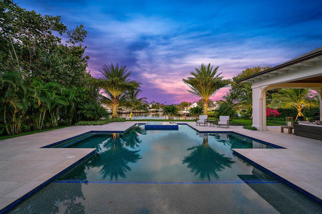 .STOP YOUR HOME SEARCH This home has it all...Over 120' of waterfrontage. Luxury awaits you around every corner, 5 bedroom plus a club room, a master suite fit for a King and Queen, sleek in design plus a 4 car garage. Chef's kitchen with an over-sized back lit center island prep station, dual wall ovens, LaCornue gas range, all overlooking the family room and breakfast area. Surround yourself in luxury in the Master Suite - His and Hers baths, boutique style closets, soaking tub and large shower. Spend countless hours outdoors looking down the water, enjoying the resort style pool and lounging area. Protected dock for a 70' boat just minutes from the Intracoastal. All located in the stunning community of Admirals Cove.
