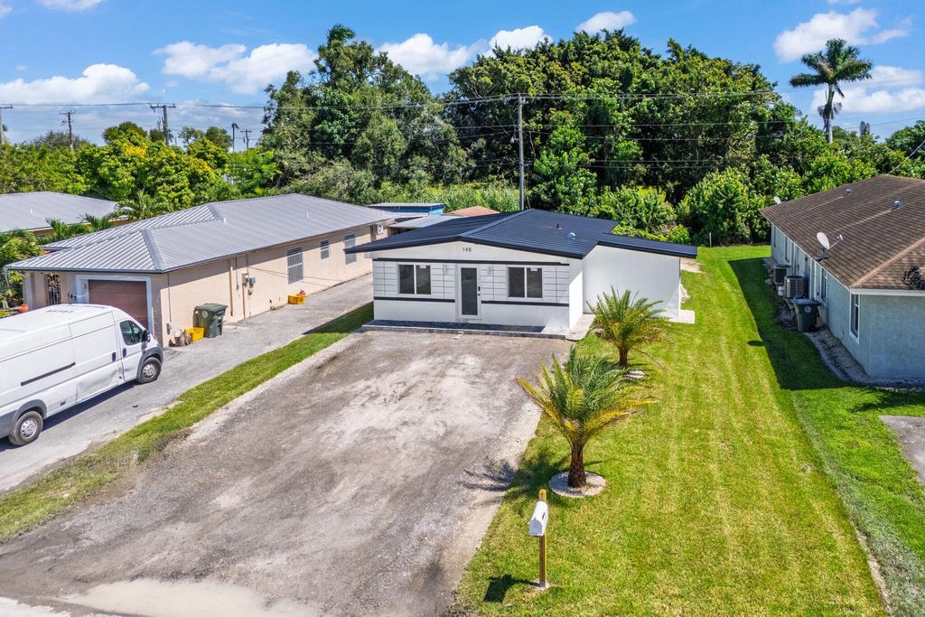 Photo of 145 NE 1st Street, Belle Glade, FL 33430 (MLS # R11128932)