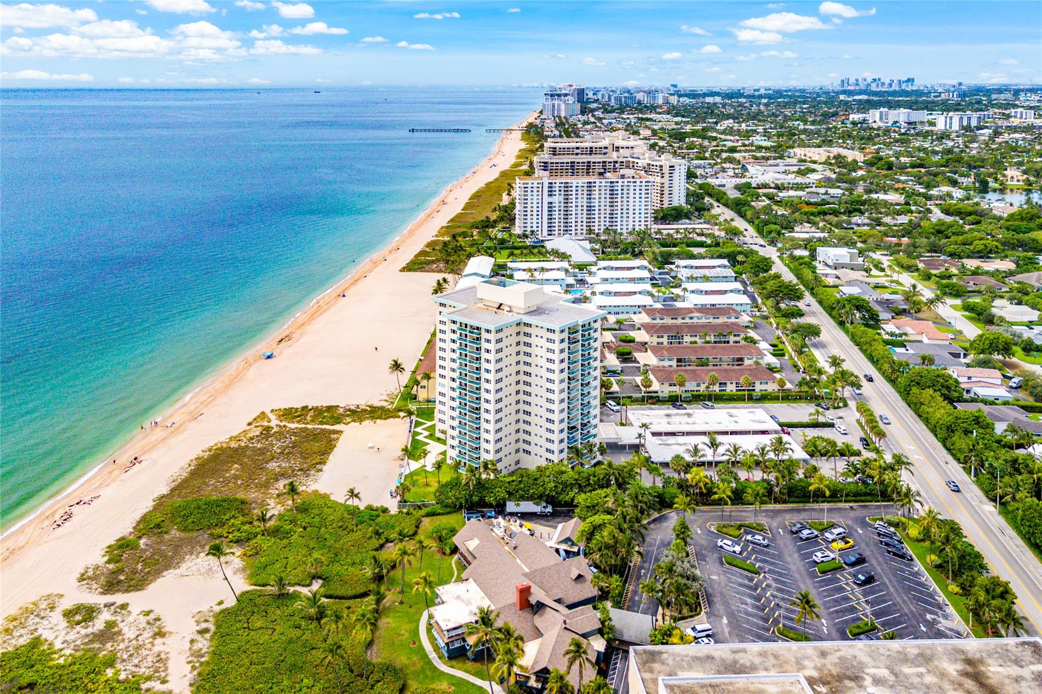 Hidden gem on the beach! This beautifully updated 2-bedroom, 2-bath condo features a spacious split bedroom floor plan, perfect for privacy and comfort. Enjoy a sleek updated kitchen, new floors, and impact windows and doors throughout. Step out onto your private glass balcony and take in stunning views of the ocean and city skyline. Resort-style amenities include a large sandy beach, heated pool, fitness center, 24-hour security, secure lobby, and extra storage located on your floor. The building and grounds are impeccably maintained, offering the ideal blend of luxury, security, and coastal living. Don’t miss this rare opportunity—schedule your private showing today!