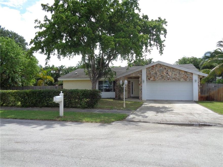 Charming California Style 3/2 home on CORNER, OVERSIZED, CUL-DE-SAC LOT in Palm-Aire Village.  Lovely covered patio leading to open 18x36 heated & cooled, saltwater Pool & Spa! Home features a split bedroom plan. Sunken living room with beautiful fireplace and custom stone wall. Crown molding. Kitchen is open to living area.  Impact Glass on front window & door.  Garage door & side garage door is Hurricane proof!  Roof replaced in 2005.  A/C replaced with 5 ton unit. Great location between Turnpike & 95.