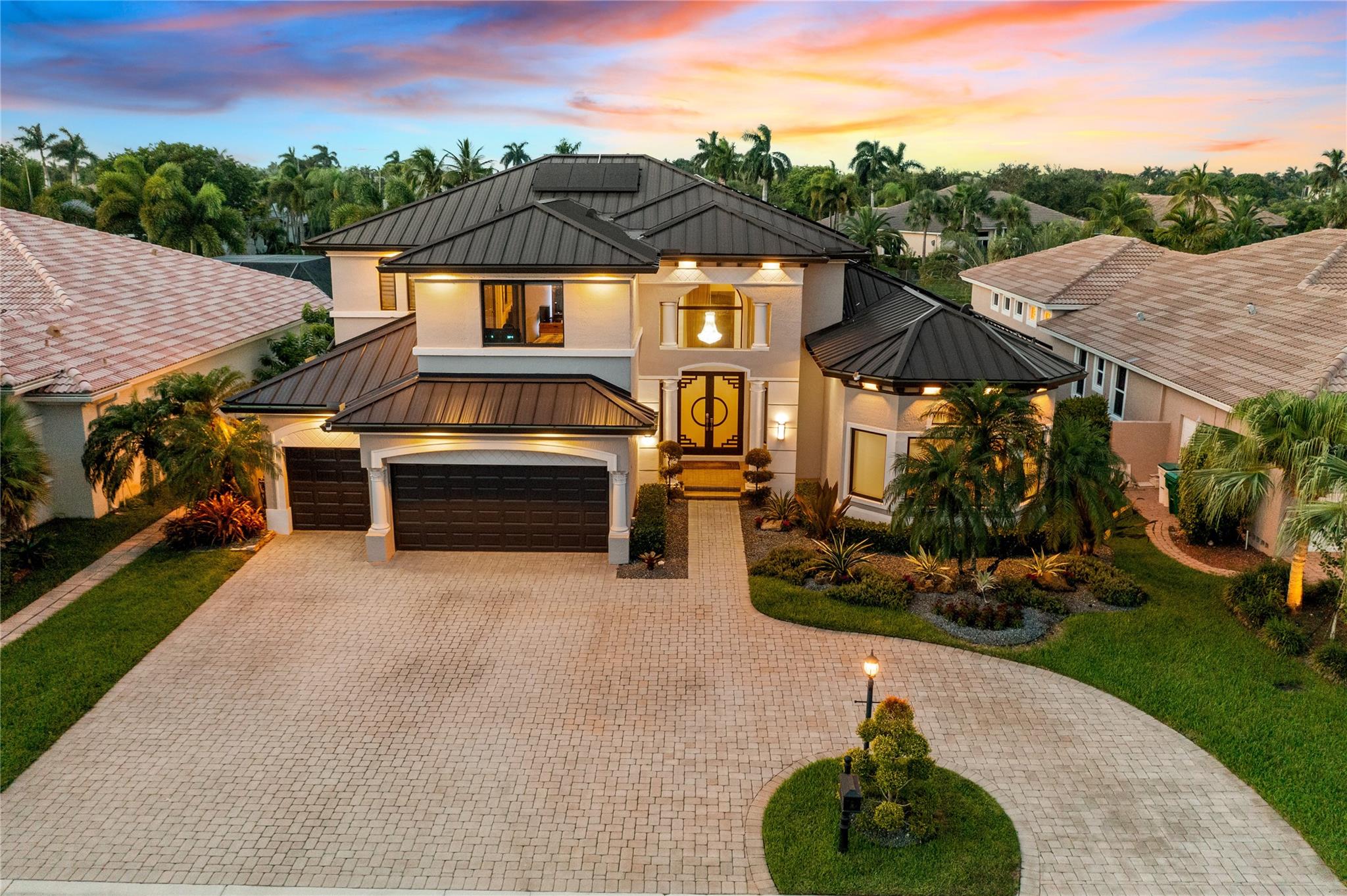 Over $374K In Upgrades! Diplomat Model w/5 Beds, 4 Full Baths, 2 Half Baths, Loft, Office, & 3-Car Garage. 2024 Metal Roof w/Solar Panels, Full Impact Glass, Freshly Painted Exterior, Resurfaced Saltwater Pool & Spa w/Beach Entry, Travertine & Turf Outdoor, Summer Kitchen w/Cedar Ceiling. Updated Primary Bath, 3 Walk-In Closets & Vinyl Floors. Quartzite Kitchen Waterfall Counters & Backsplash, Bosch Induction Cooktop & Dishwasher, Soft-Close Cabinets, Updated Mini Bar. Custom Built-Ins In Office, Quartz Laundry Counters, Hardwood Floors Upstairs, And An Updated Upstairs Bath. Travertine Floors In Main Living, Crown Molding, Newer Pool Heater, Lush Landscaping & Water Views! 2 Clubhouses w/Resort-Style Amenities Including Tennis, Fitness Center, & More, 24-Hour Guard Gated, A+ Schools