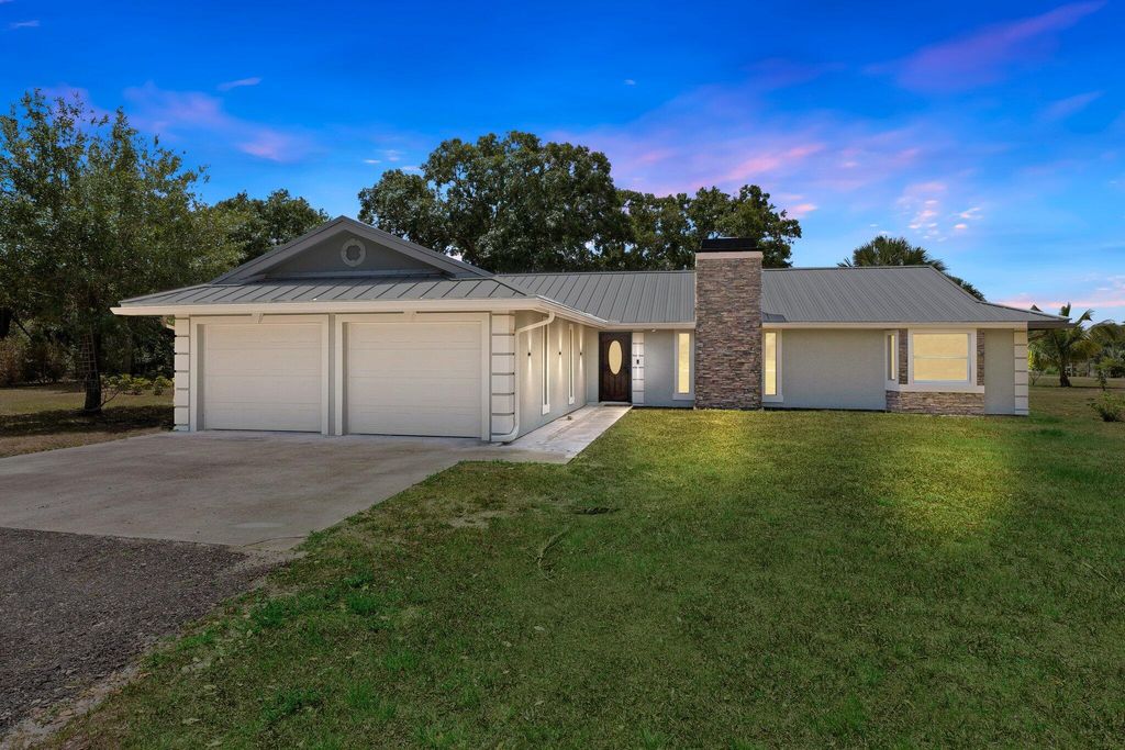 Photo of 11861 Palomino Drive, Port Saint Lucie, FL 34987 (MLS # R10993578)