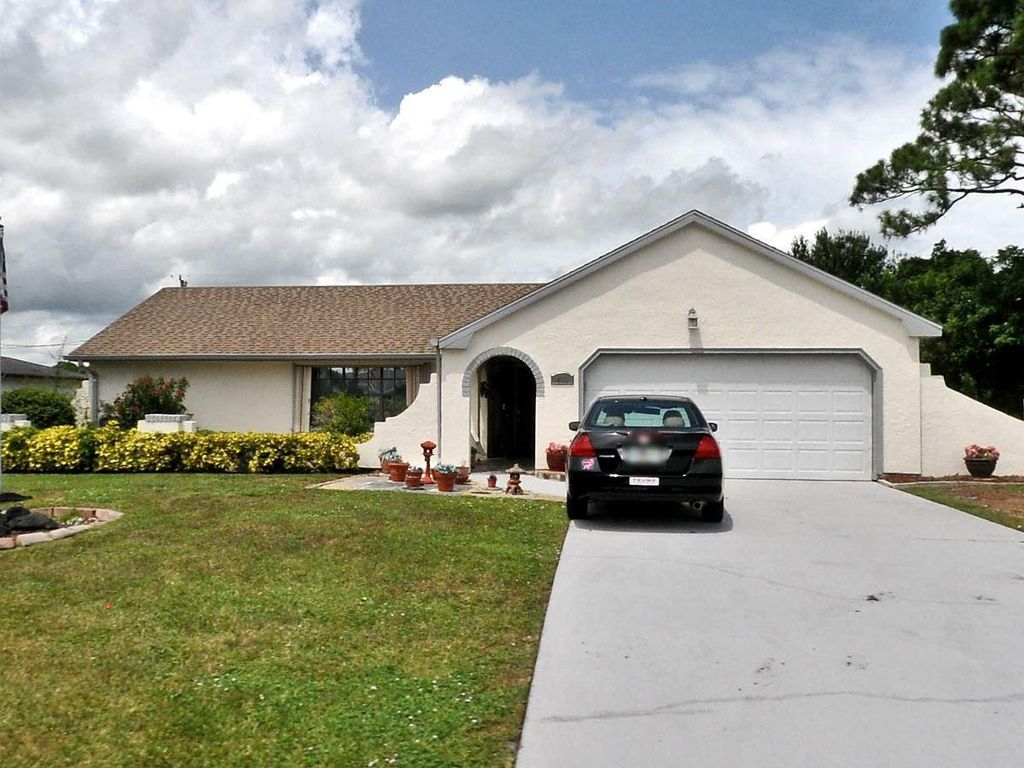 Photo of 409 S Naranja Avenue, Port St Lucie, FL 34983 (MLS # R10849554)