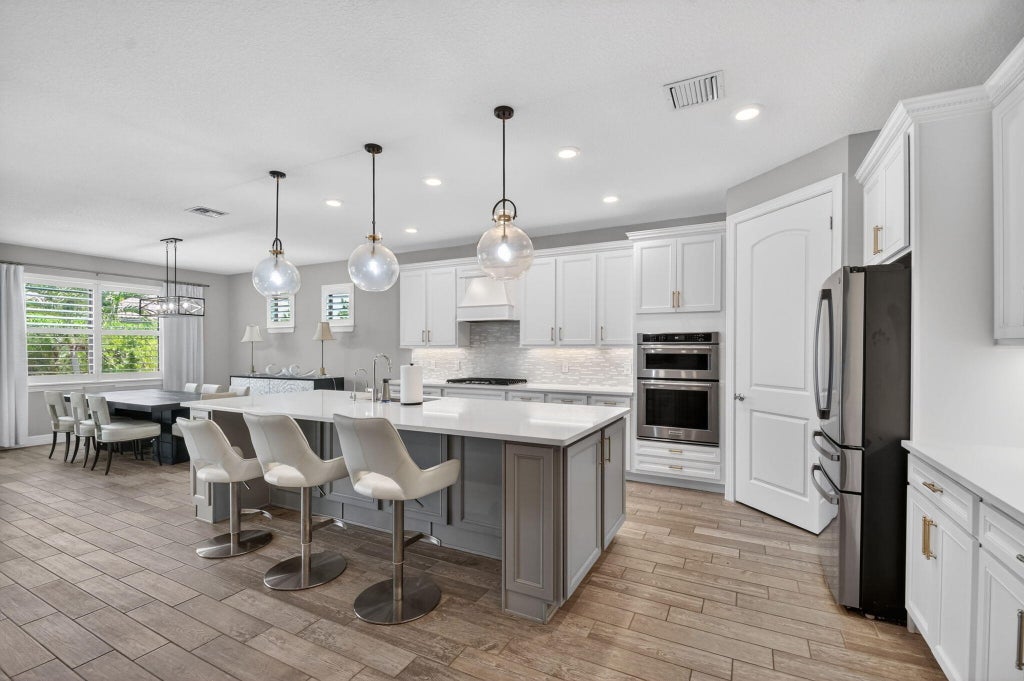 Photo of 8433 Vaulting Drive, Lake Worth, FL 33467 (MLS # B26032276)