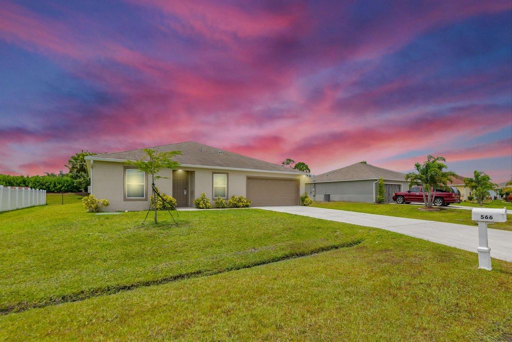 Photo of 566 SW Grove Avenue, Port Saint Lucie, FL 34983 (MLS # R11106166)