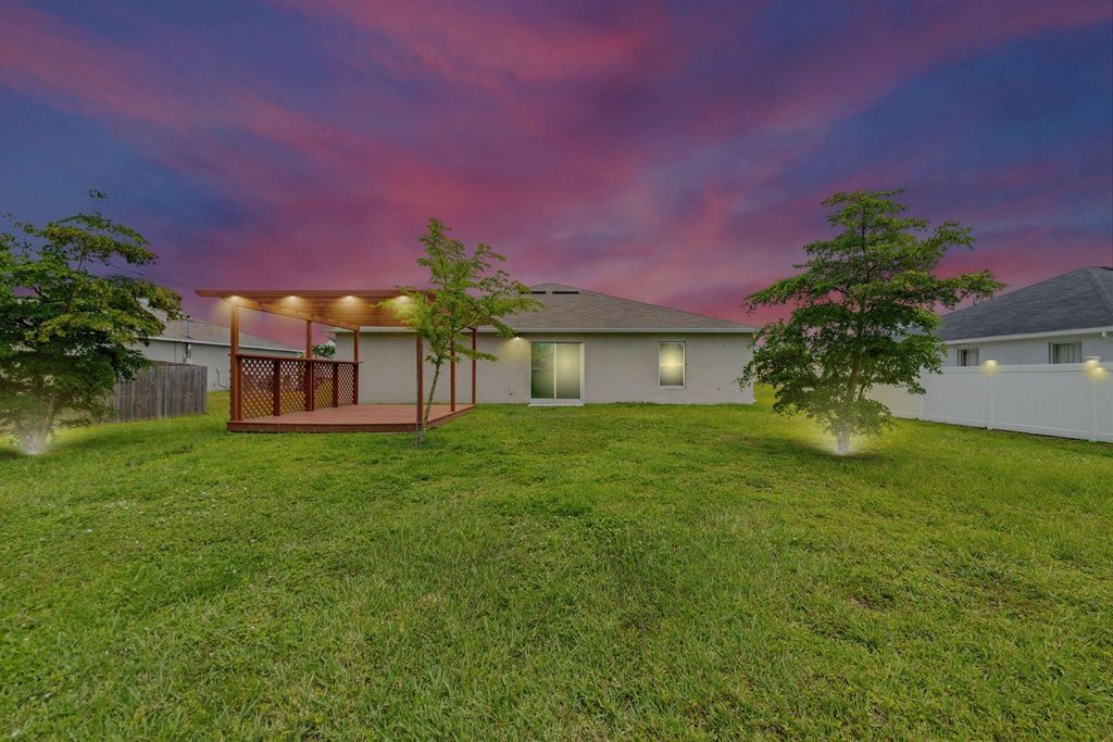 Photo of 566 SW Grove Avenue, Port Saint Lucie, FL 34983 (MLS # R11106166)