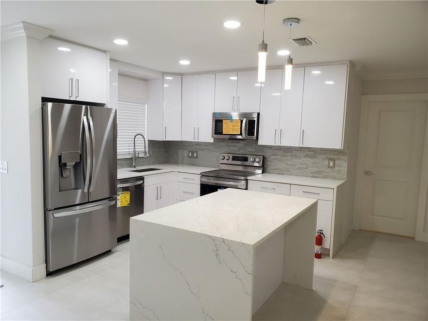 Renovated home featuring brand-new tile floors, updated kitchen with new cabinets, countertops, and appliances, as well as completely remodeled bathrooms and fixtures, all done in modern white and grey tones. The house offers a charming front open patio and a spacious screened-in back patio, perfect for outdoor relaxation. Situated in a central location, close to schools, shopping, and major roads, this home provides both style and convenience.