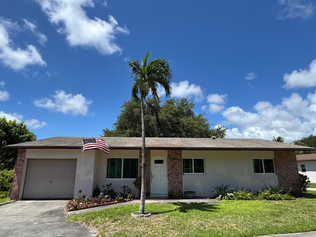 Photo of 2615 SW Natura Avenue, Deerfield Beach, FL 33441 (MLS # R11152979)