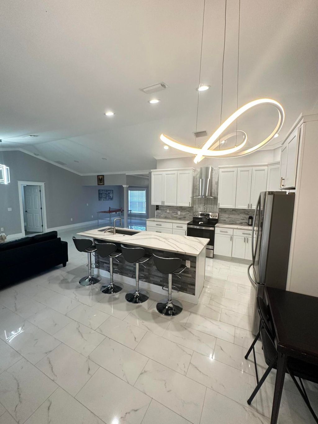 Photo of 3660 SW Bonwold Street, Port Saint Lucie, FL 34953 (MLS # B26013925)