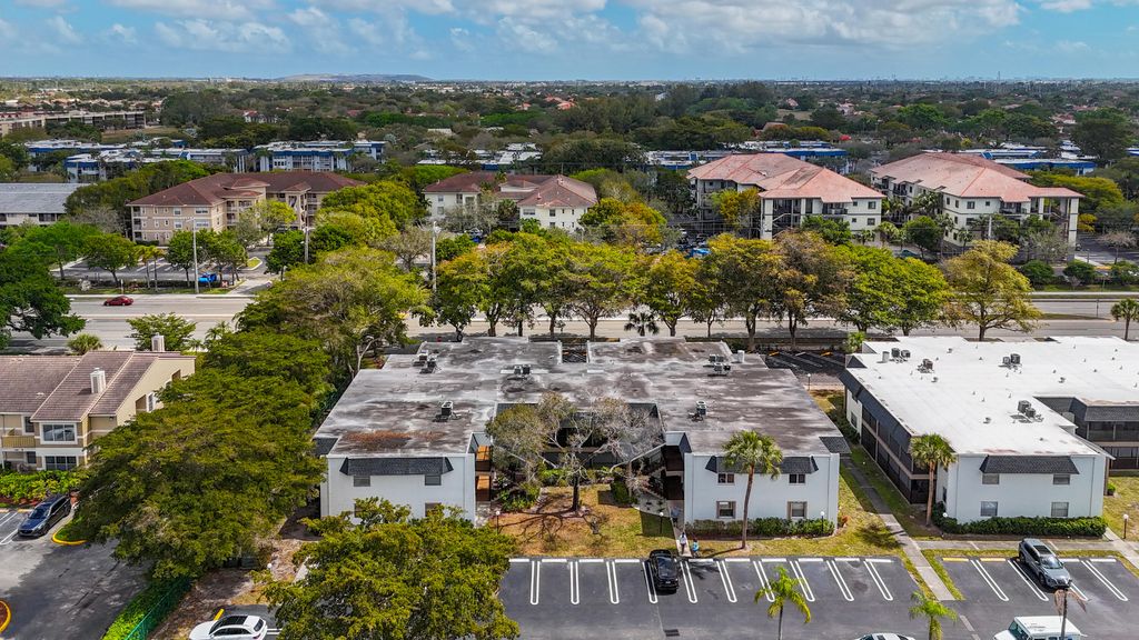 Photo of 2820 Riverside Dr #203, Coral Springs, FL 33065 (MLS # B26000352)