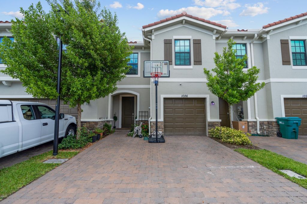 Photo of 1026 Willow Place Pl, Riviera Beach, FL 33410 (MLS # R10816668)