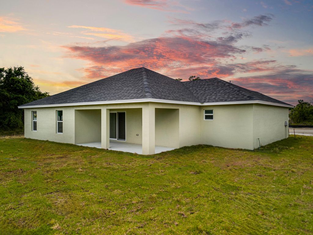 Photo of 3517 SW Port St Lucie Boulevard W, Port Saint Lucie, FL 34953 (MLS # R10944639)