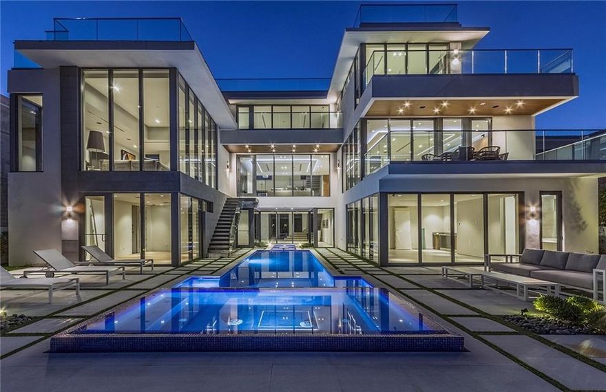 Post Minimalist Modern where sleek art meets architecture! Designed for entertaining;built for adventure, this elegant tri-level home has exciting new finishes.Breathtaking 35ft ceiling entry foyer overlooks a sheer glass wall to the vertical pool & canal.Spacious 2nd floor living area open chef's kitchen & great room, large loggias & expansive views, entire 3rd floor master suite. Lounge in luxury, while relaxing on your generous terrace or private roof gardens.Surrounded by high quality new residences!