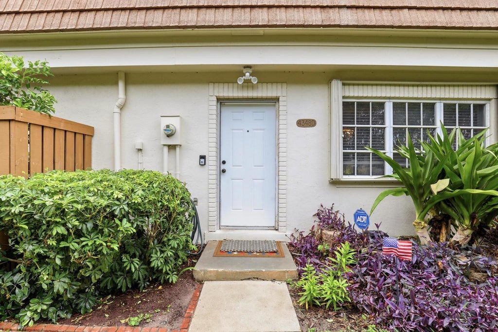 Photo of 4348 HAZEL Avenue #D, Palm Beach Gardens, FL 33410 (MLS # B26062850)
