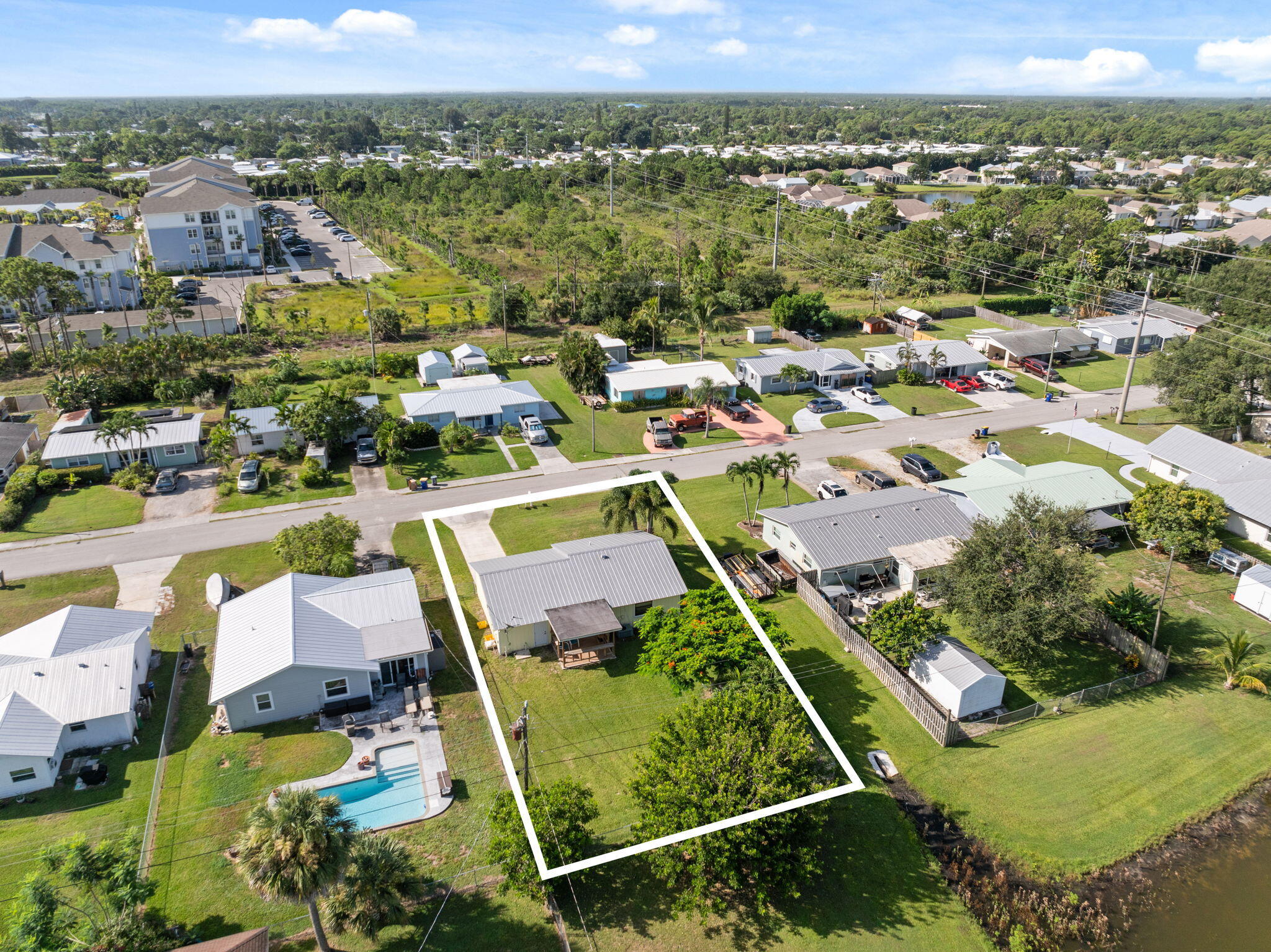 Positioned on a corner lake view lot, this residence presents a unique opportunity in the heart of Stuart. Ideally located just moments from shops, dining, and pristine beaches, the home is well-suited for a first-time buyer or investor. Thoughtfully maintained and ready to be enjoyed as-is or reimagined with modern enhancements to unlock its full potential. No HOA. A versatile property offering both lifestyle and investment appeal in one of Martin County's most convenient locations.