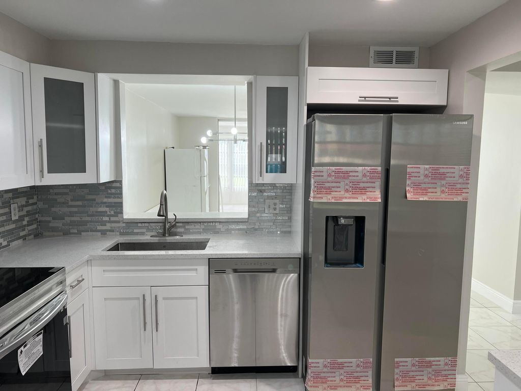 Photo of 24 Abbey Lane #204, Delray Beach, FL 33446 (MLS # B26038607)
