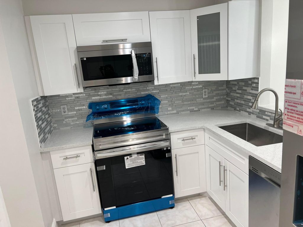 Photo of 24 Abbey Lane #204, Delray Beach, FL 33446 (MLS # B26038607)