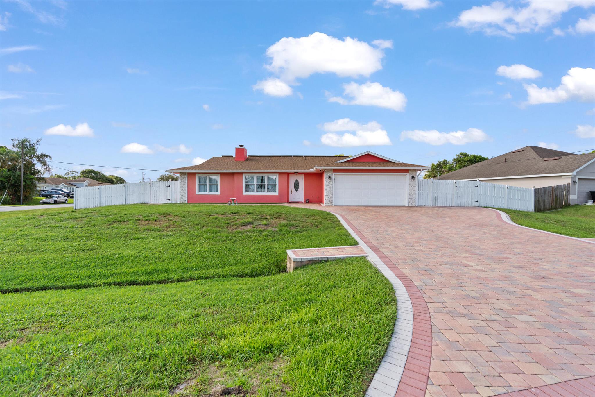 Beautifully Renovated Pool Home with Modern Upgrades on Oversized Corner Lot! Welcome to this move-in-ready 3-bedroom, 2-bath, 2-car garage home located in a desirable Port Saint Lucie neighborhood. Situated on a spacious 0.33-acre corner lot, this 1,446 sq ft residence offers updated peace of mind with: NEW Roof (2025), NEW A/C (2024), and a NEW Water Heater (2025). Fully fenced. Enjoy the private pool--ideal for entertaining or relaxing with a screened in patio and windows overlooking the pool area. House includes PAID-OFF solar panels for low energy costs. The air-conditioned shed is perfect for a workshop, home gym, or creative studio. Inside, the open-concept layout is filled with natural light.
