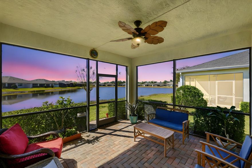 Experience captivating panoramic lake views and sunsets from this stunning 2-bedroom plus den villa in LakePark at Tradition. The 1,565 sq. ft. interior features an open great room, volume ceilings, and a chef's kitchen with a large island and premium appliances. The primary suite offers a private retreat with water views and a large walk-in shower. Modern comforts include impact glass windows and a new water heater being installed for peace of mind. Enjoy the nightly light show from your screened lanai or dive into the 55+ resort lifestyle with access to two clubhouses, fitness centers, and pools. The HOA covers cable, internet, and landscaping, ensuring total maintenance-free living in this premier waterfront community. Nestled in the premier LakePark at Tradition 55+ community, you'll enjoy a resort lifestyle with access to two clubhouses, fitness centers, and swimming pools all while the HOA handles cable, internet, and landscaping for total maintenance-free living.