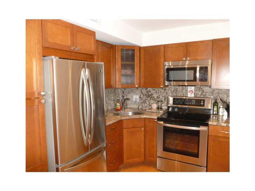GRAB THIS BEAUTIFULLY UPDATED LARGE 1 BEDROOM 1.5 BATH TOP-FLOOR CONDO IN EMERALD HILLS COUNTRY CLUB CONDO. NEW LAMINATE FLOORS THROUGHOUT. COMPLETELY & NEWLY UPDATED KITCHEN & BATHROOMS. ALL NEW STAINLESS STEEL APPLIANCES,THICK GRANITE COUNTERS. SCREENED BALCONY. LOTS OF CLOSET SPACE. ADJACENT TO LAUNDRY ROOM & ELEVATOR.RENT INCLUDES WATER,SEWER,EXPANDED BASIC CABLE, PEST CONTROL.LOTS OF AMENITIES 2 POOLS,SAUNA,GYM,REC ROOM.CLOSE TO SHOPPING,PLACES OF WORSHIP & BEACH. GREAT LANDLORD!