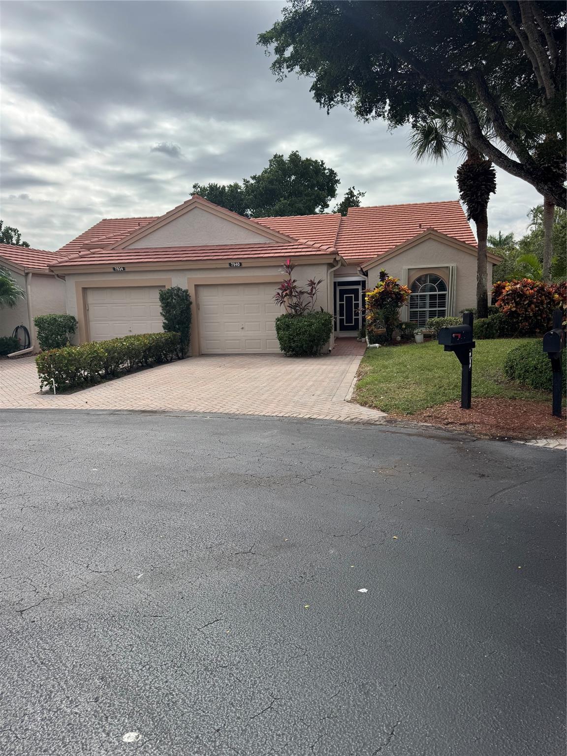 PRICED TO SELL. BRING ALL OFFERS. Home professionally painted. Must see. Hibiscus Model a picturesque private lake. 2-bedroom 2 bath villa, on a quiet cul-de-sac, oversized lot, surrounded by lovely foliage. This home offers all ceramic tile throughout, update bathrooms, with many other touches of elegance. Stylish plantation shutters coverings on the interior windows, with hurricane shutters surrounding the villa for your peace of mind. The porch is completely closed in with full sliding glass doors for you quiet and personal sitting pleasure or entertaining guests. Active club house with many activities for your enjoyment. Verified 55 age. Gated community. HOA includes exterior insurance, lawn care, roof and security. Move in ready.