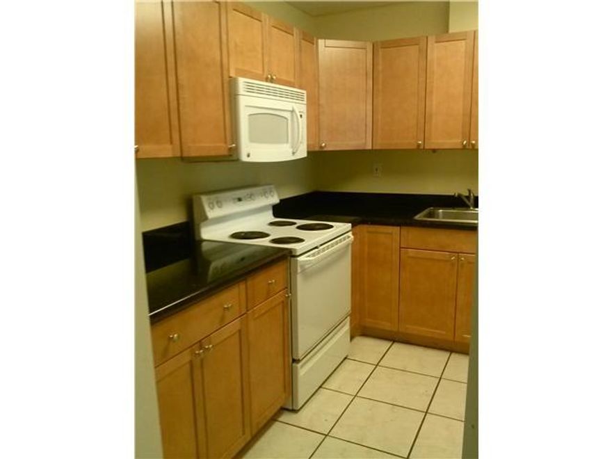 Don't miss this opportunity! Beautiful 2/1, large bedrooms w/ laminate flooring, tiled in rest of living area, beautiful cabinets and granite counters in the kitchen, long screened balcony to enjoy the fresh air! Great community close to major roads, shopping, good schools, public parks and transportation. Lots of amenities... clubhouse, 4 swimming pools(1 heated), jacuzzi, fitness center, billiards, sauna, and 2 tennis courts. Sorry no leasing within the first year. Lowest maintenance fee in complex!