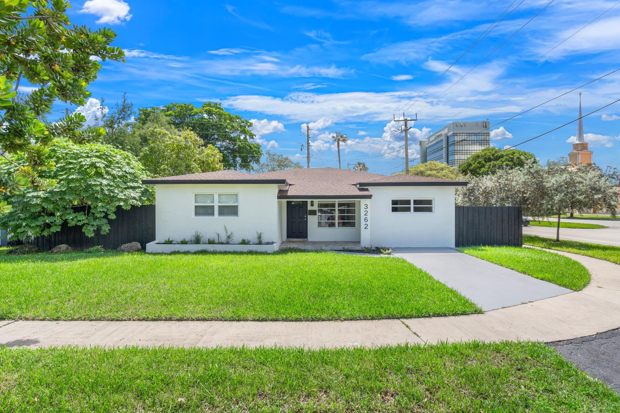 Stunning 4BR/3BA ~2200 SQFT home with bonus suite featuring private entrance, bath & courtyard—perfect for rental, in-law, or office. Substantially remodeled, with modern kitchen, sleek baths, new washer & dryer, seamless flooring, high-hat lighting, fresh paint, new baseboards & NEW ROOF! Covered rear parking. Never lived in since upgrades—100% move-in ready. Steps to Publix, Target & endless dining. Minutes to downtown Hollywood, parks, beaches, and midway between Miami & Fort Lauderdale. Live in style, location & flexibility—this one has it all. Run, don’t walk! Virtual Staging on Some Pictures.