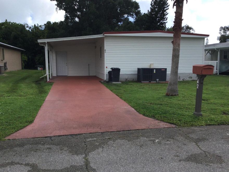 This home recently underwent a total rehab.  New vinyl plank flooring, new kitchen with granite counters, baths, windows, finished drywall, 2024 roof, ac unit and hotwater heater.  You must see this home that is situated on the golf course.Lot rent covers all amenities, taxes, lawn care and trash removal.  Amenities include golf, two pools. tennis, pickleball, shuffleboard, bocce, billiards, ping pong, clubhouse, party room, game room, dog park and much much more.  Future residents must be approved by Spanish Lakes.  Call for application.