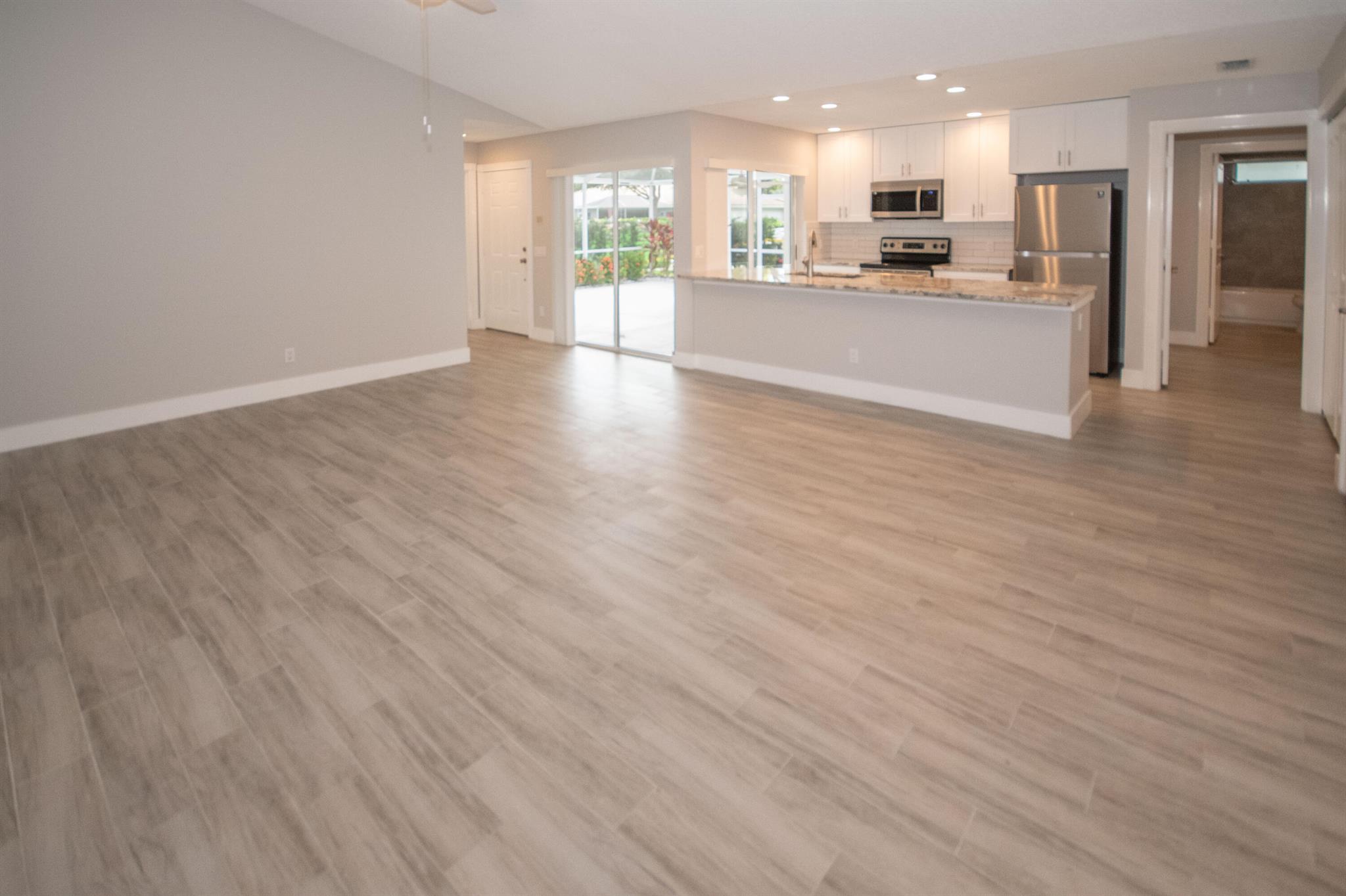 Superbly updated Villa in The Best Location & Move in Ready!!! Divosta 'Built Solid', all 1-story (no stairs) w/incredible floorplan includes 2 primary bedrooms each w/their own updated very private on-suite bathrms. Open concept living/dining/kitchen w/massive bar-counter 4 plenty of seating +a sea of scrumptious quartz countertops, shaker style cabs, pantry & entire suite of SS Appliances, including Deep SS sink, no popcorn ceilings, a lovely custom built white shaker style buffet counter w/quartz counter top & LOADS of storage off DR that's as fabulous, as it is functional. Custom Closets throughout, neutral Tile(wood look) Flooring, Inside W/D. Spacious courtyard w/covered Patio & Storage area+++WON'T DISSAPOINT-A TOTAL MUST C! Don't miss out on this Hard 2 come by-Totally Updated gem