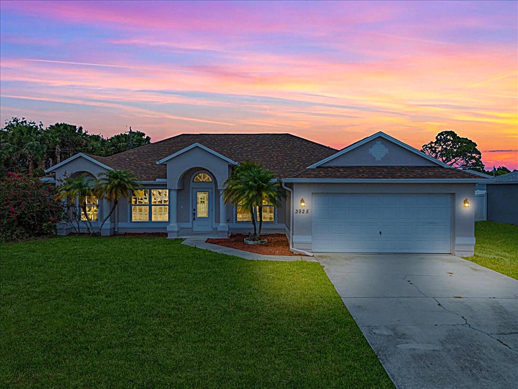 Photo of 3925 SW Helmlinger Street, Port Saint Lucie, FL 34953 (MLS # R11110826)