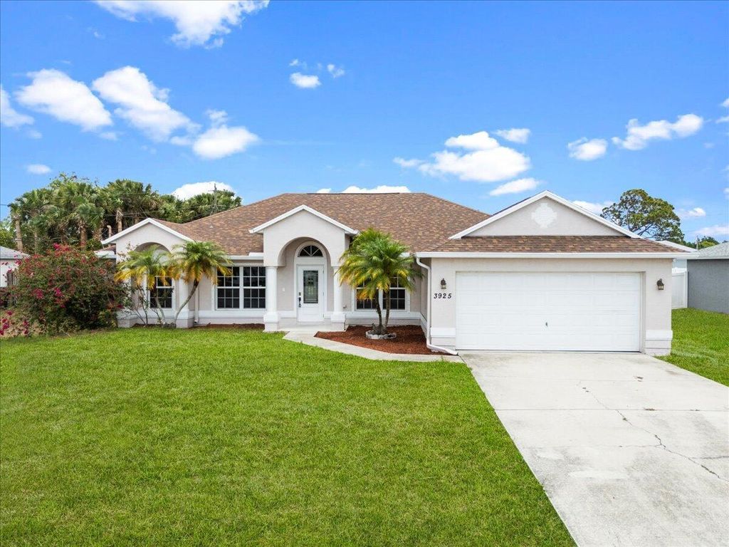 Photo of 3925 SW Helmlinger Street, Port Saint Lucie, FL 34953 (MLS # R11110826)