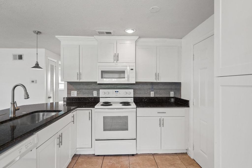 Photo of 1048 SW 30th Street, Palm City, FL 34990 (MLS # R10955880)