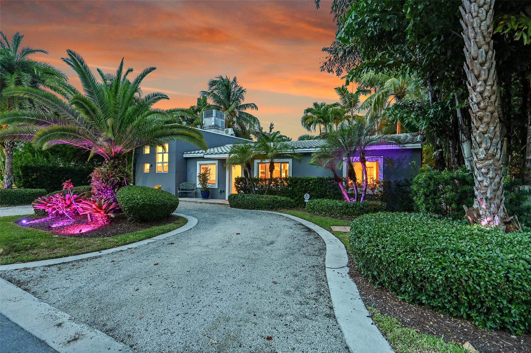 Beautifully maintained 3 Beds /2.5 Baths in the Wilton Manors Central neighborhood, just minutes from Wilton Drive. This open-concept home is perfect for entertaining and relaxation featuring updated kitchen and baths, impact windows/doors, and a lush, resort-style backyard. Relax on the expansive travertine patio under a pergola with new tiki roof (2023), in the sparkling pool with new Diamond Brite and fountain (2025), or in the separate heated spa. Landscape lighting highlights a Certified Wildlife Habitat with 60+ plant species. The primary suite with vaulted ceilings, large walk-in closet, beautiful en-suite bath, mini-split A/C (2021), and access to the pool and outdoor shower. Guest rooms include built-in closet/dresser systems and lovely garden views.