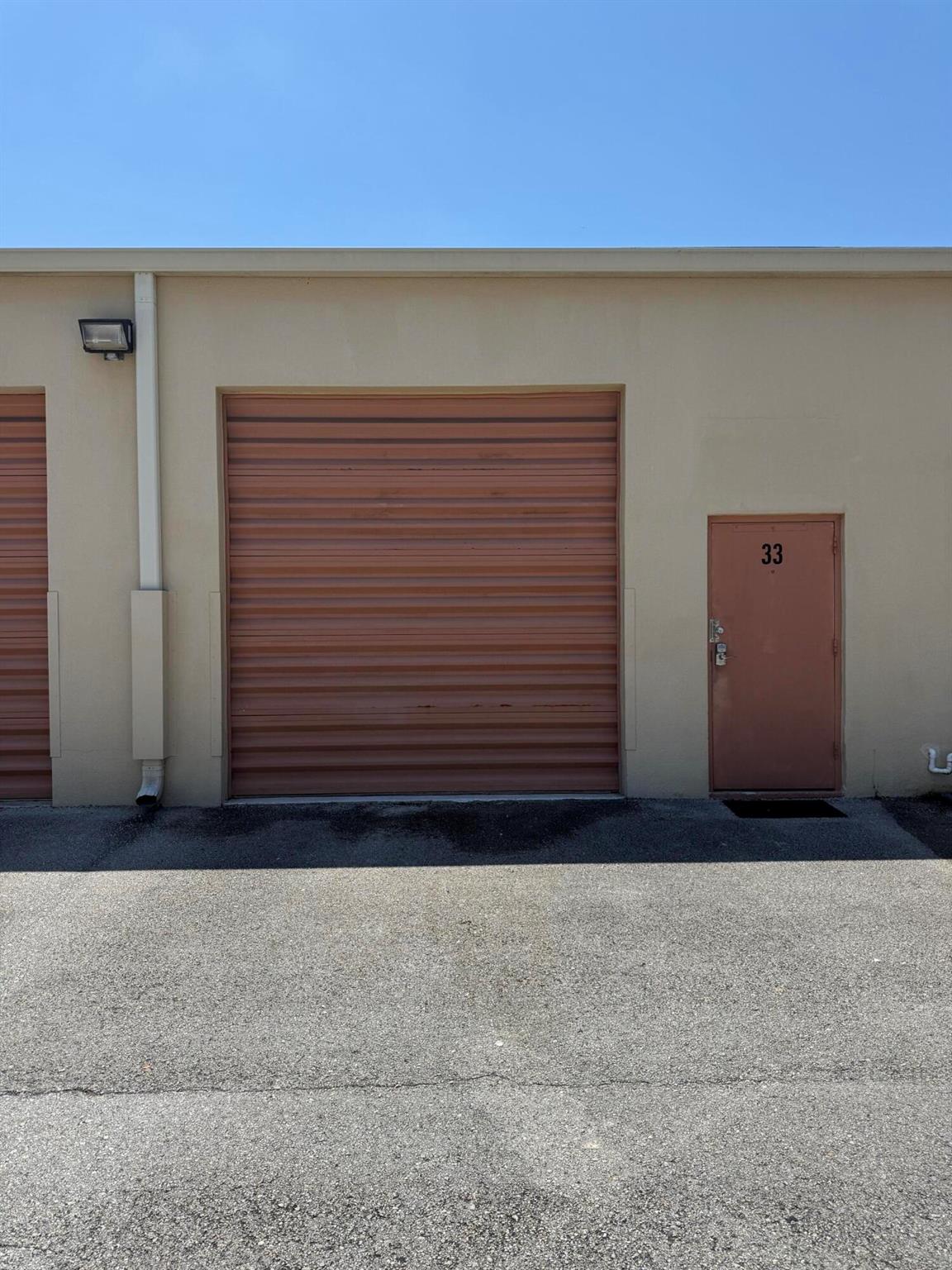 Discover this updated warehouse space in the heart of Jupiter! Features include five 4-gang duplex outlets, a new 3 ton American Standard AC, and custom double wall spiral duct with four air vents. The unit is professionally painted, with full LED lighting and a new security keypad lock.Amenities include an automatic garage door with remotes, durable epoxy flooring, ample parking, and easy access with low-profile transitions for vehicles. Enjoy city water hookup and two man doors with the option to install a glass front. Plus, benefit from low quarterly HOA fees. Don't miss this rare opportunity!