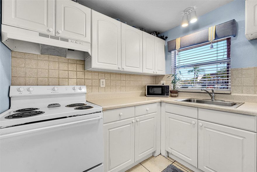 Rarely available 1BR/1BA first-floor corner unit featuring a brand-new walk-in shower and a bright white kitchen. This clean, comfortable home offers easy access, great natural light, and a layout that feels larger than expected. Association budget looks great! Perfect opportunity for a buyer looking for value—seller is actively seeking offers. The unit includes a service contract, which is covered under the low monthly maintenance. The Low Monthly fee includes: Water, Insurance, Building exterior, Pool, Club house, Maintenance contract and so much more!