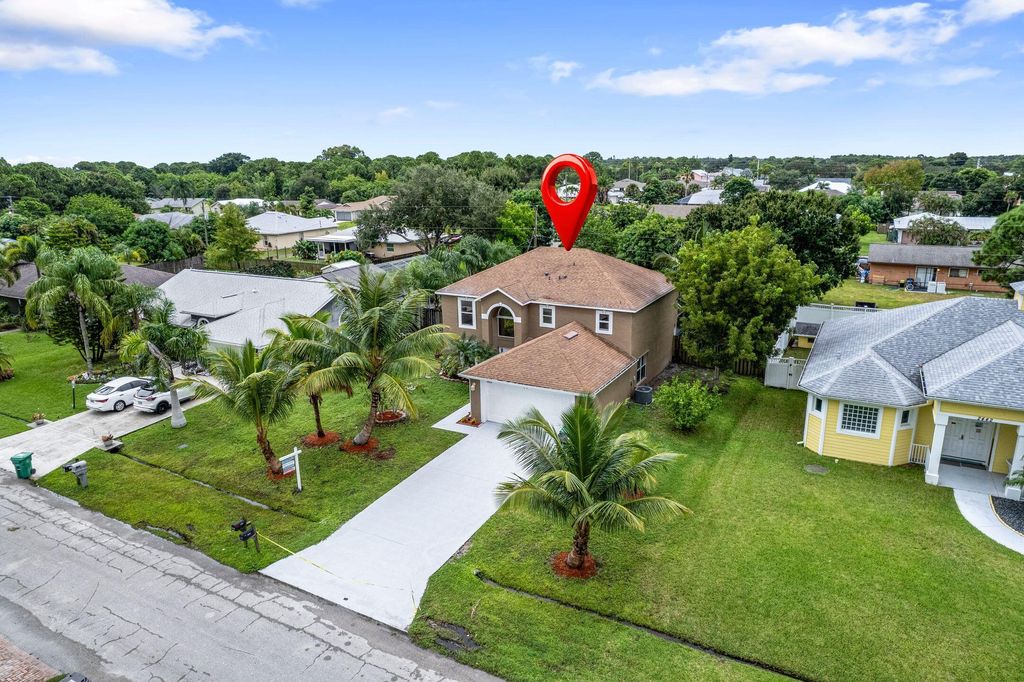 Photo of 2452 SE Victory Avenue, Port Saint Lucie, FL 34952 (MLS # R11130316)