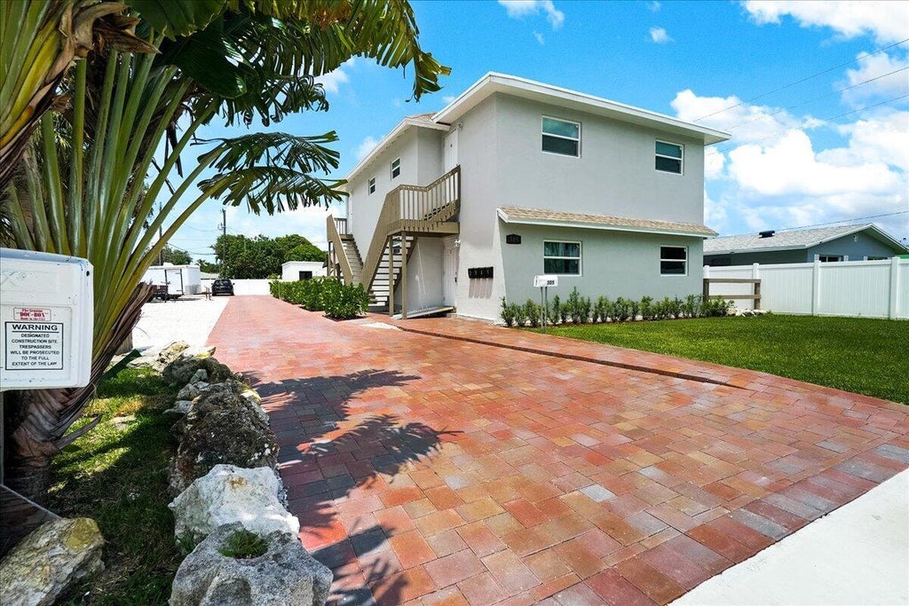Photo of 305 CYPRESS Drive #1,2,3,4,5, Lake Park, FL 33403 (MLS # B26080606)